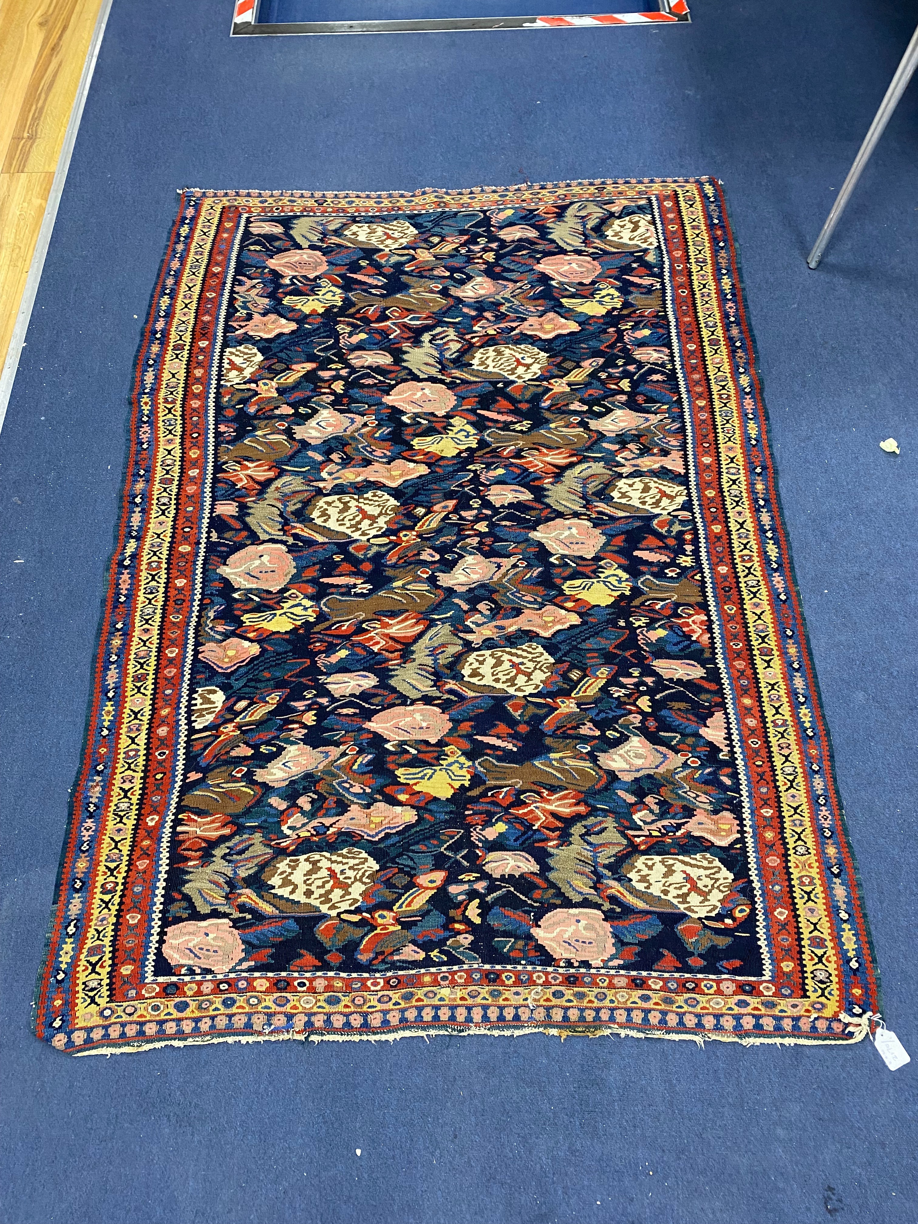 A late 19th century / early 20th century Senneh polychrome Kilim rug, 190 x 130cm